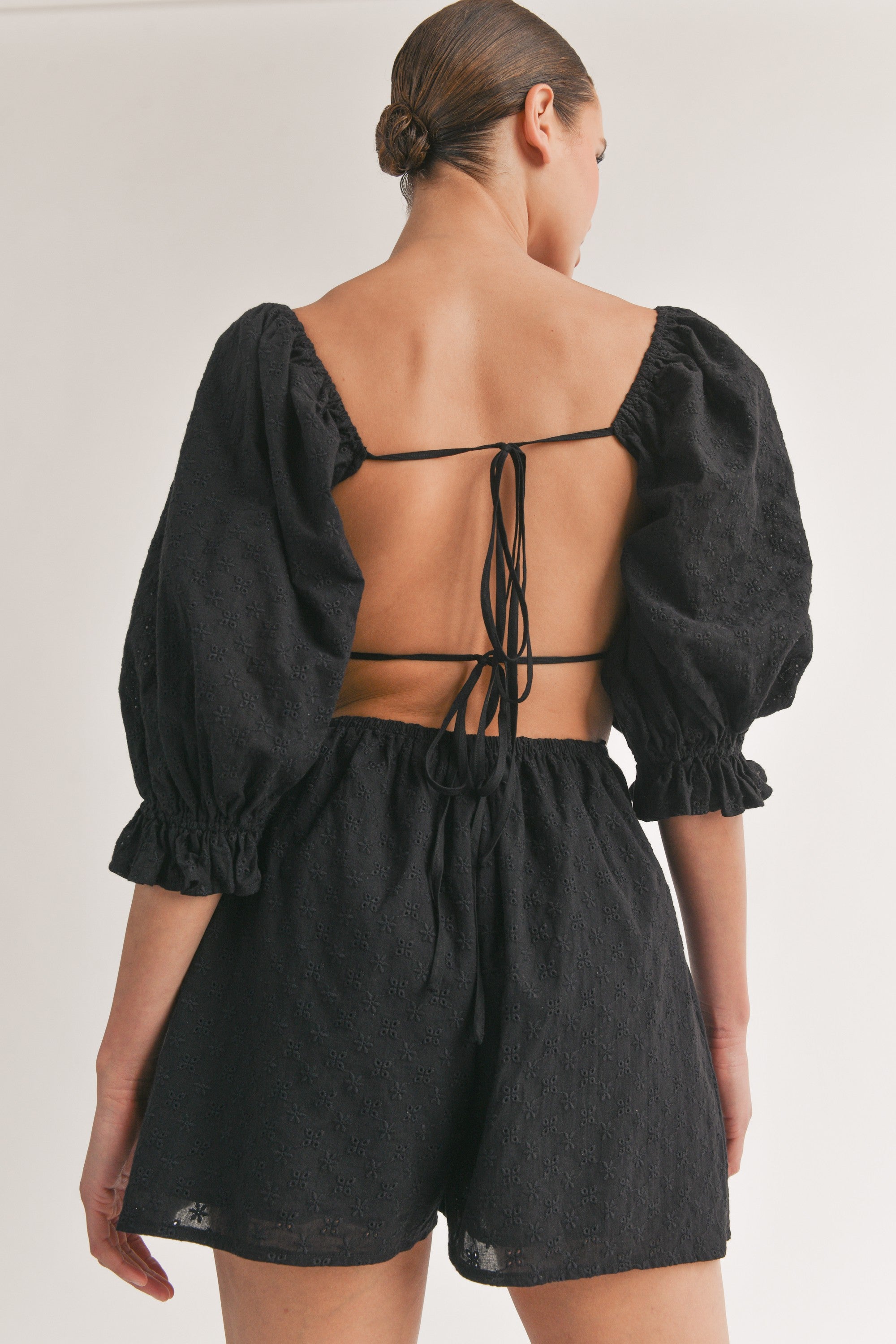 Black Bubble Sleeve Eyelet Romper with Open Back | Collective Request 